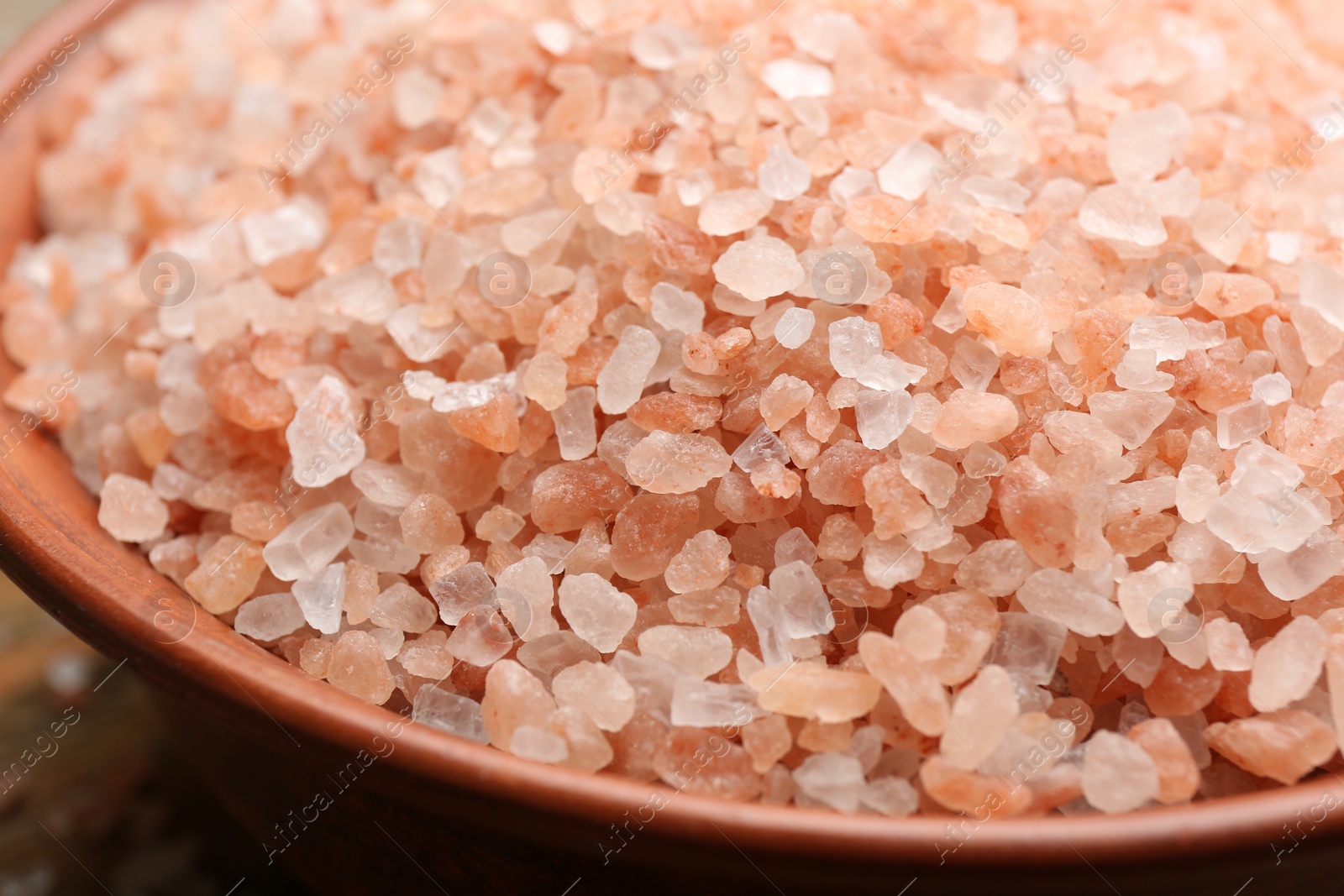 Photo of Pink himalayan salt in bowl, closeup view