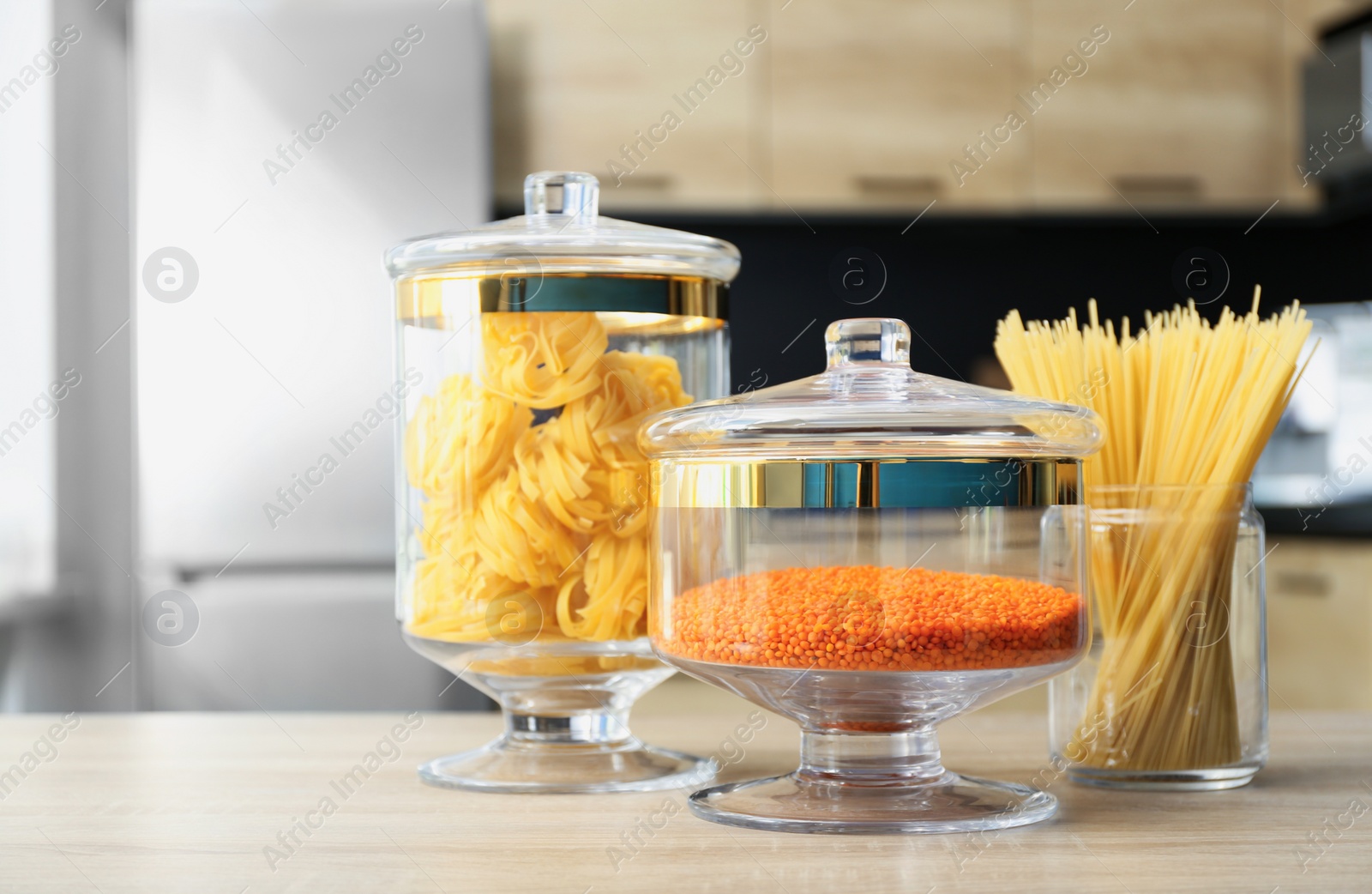 Photo of Products on wooden table in modern kitchen