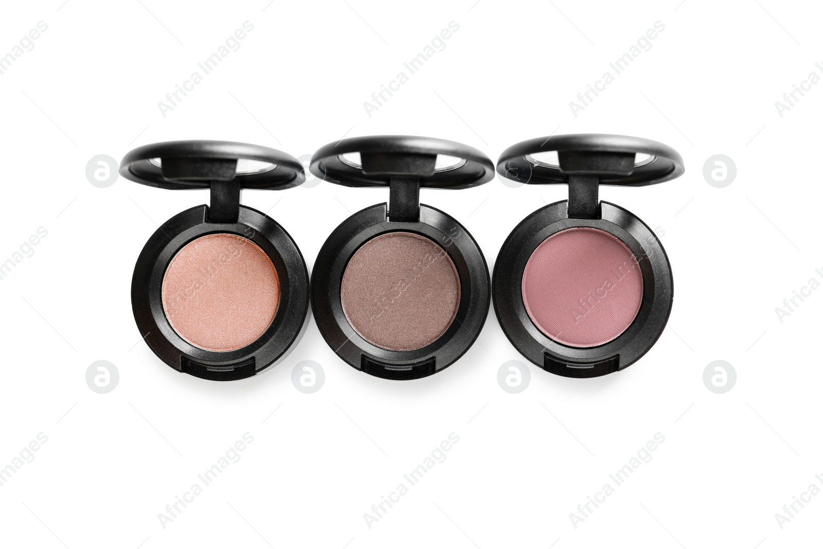 Photo of Different eye shadows on white background, top view. Decorative cosmetics