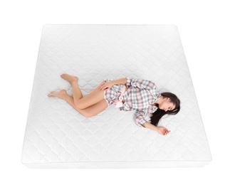 Young woman sleeping on mattress against white background, above view