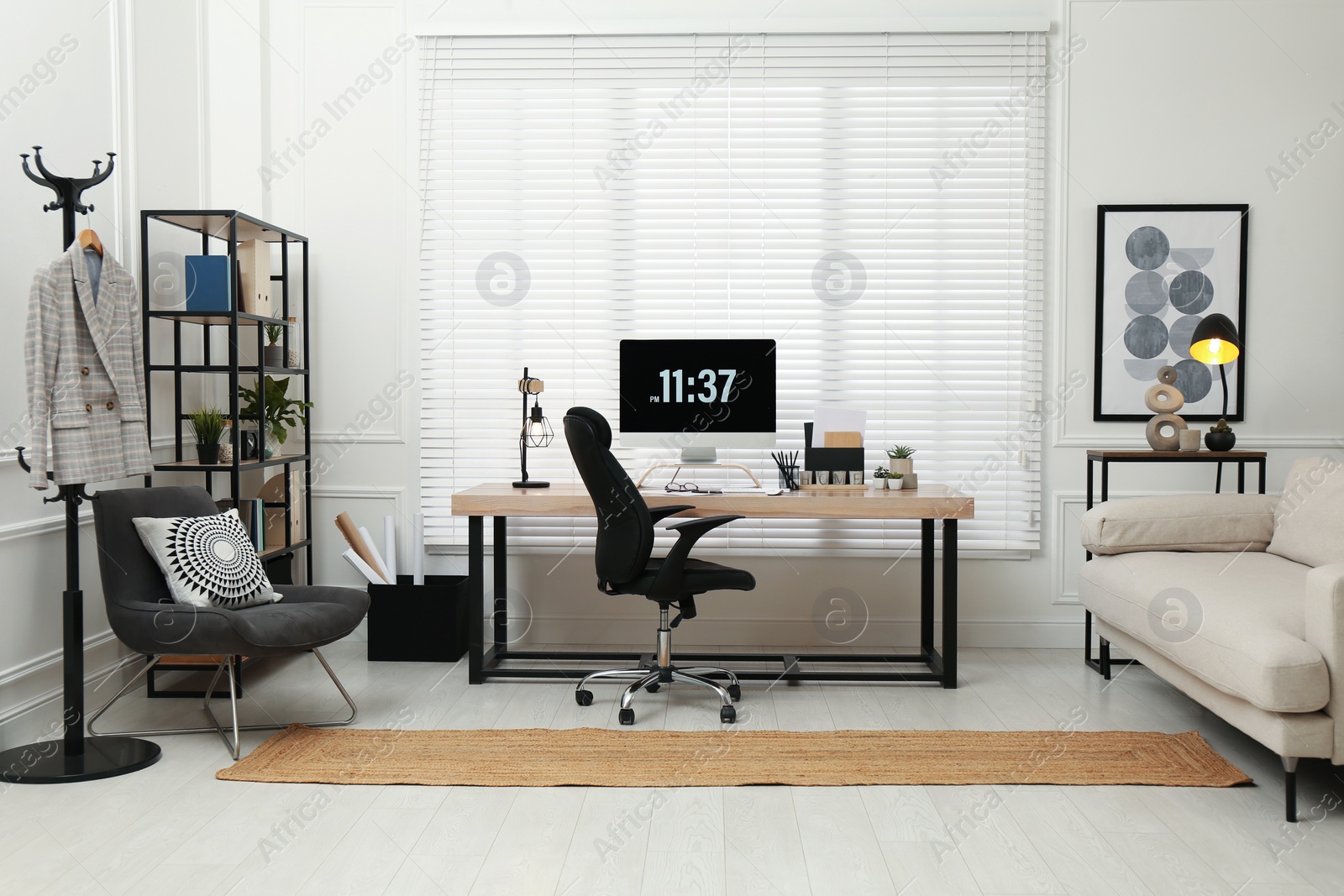 Photo of Home office interior with comfortable workplace near window