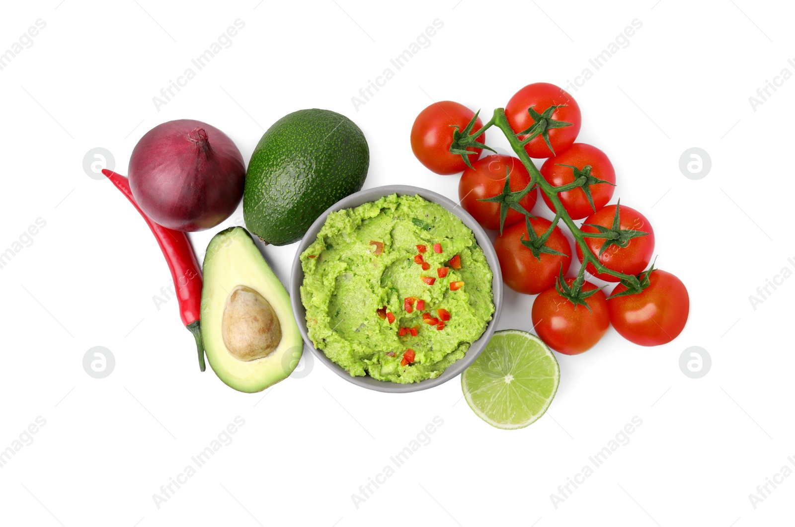 Photo of Bowl of delicious guacamole and ingredients isolated on white, top view