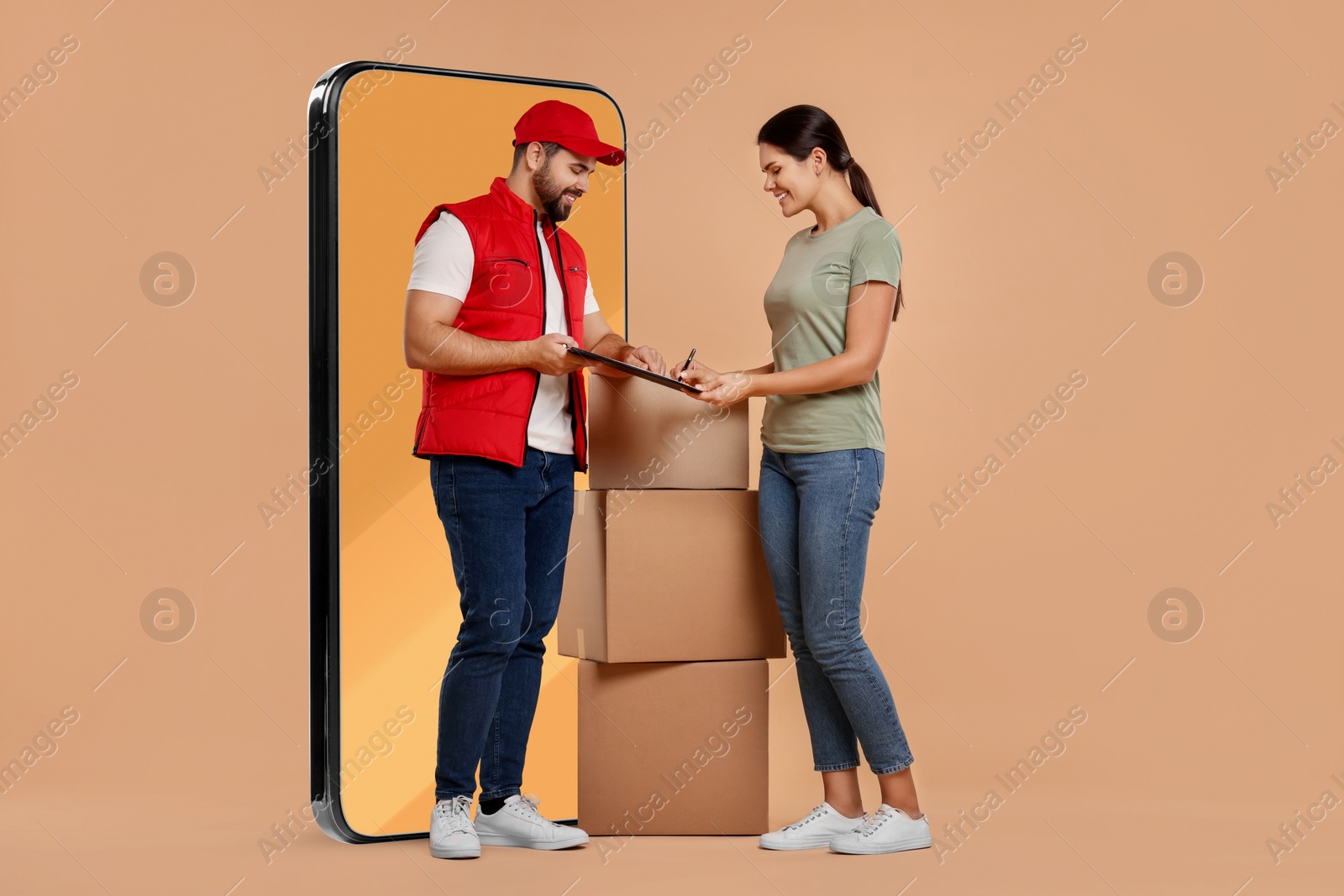 Image of Courier delivering parcels to woman near huge smartphone on dark beige background