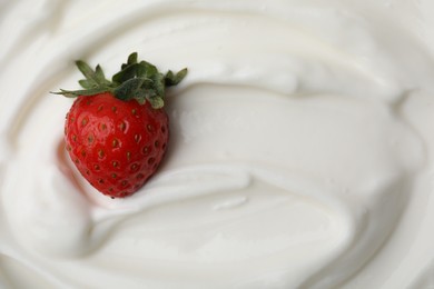 Tasty yogurt with strawberry as background, top view. Space for text