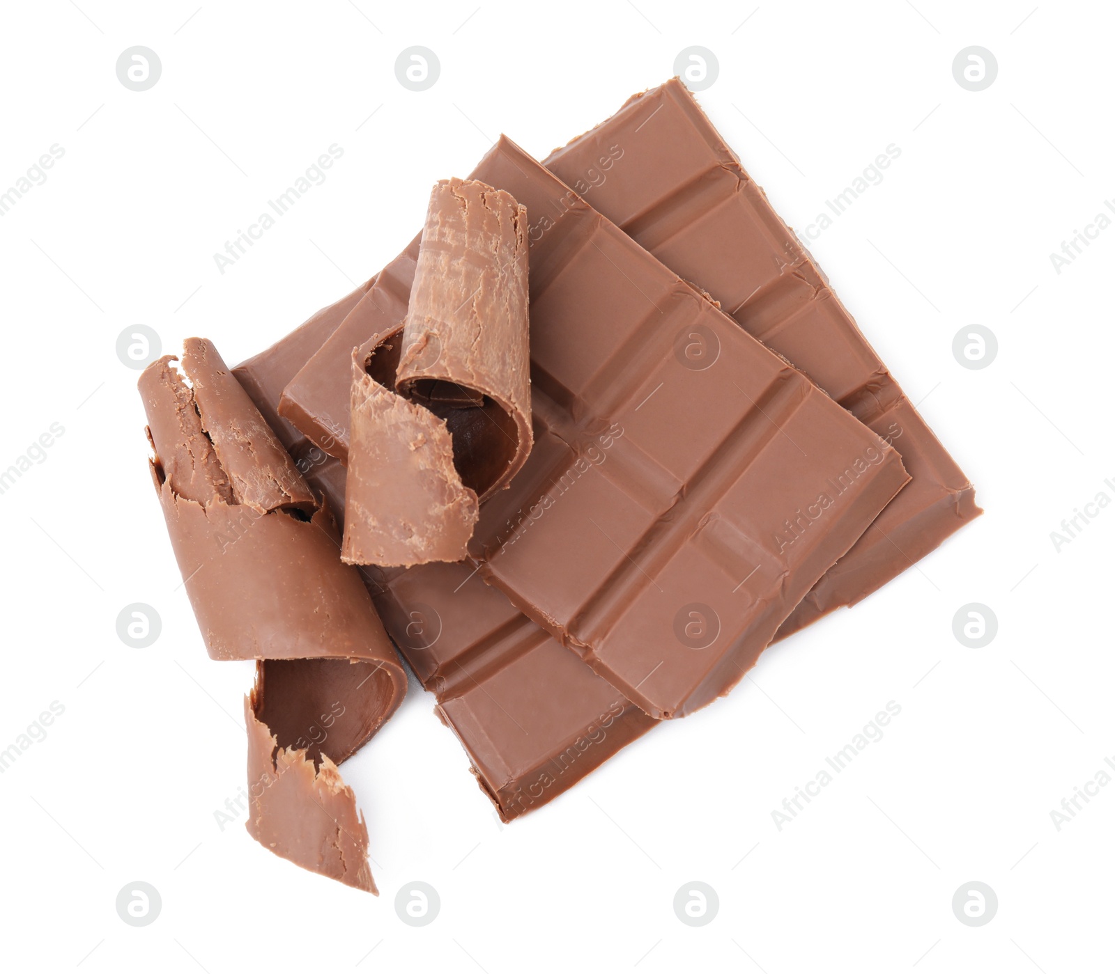 Photo of Pieces of tasty chocolate bar and shavings isolated on white, top view