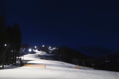 Beautiful landscape with ski track at night. Winter vacation