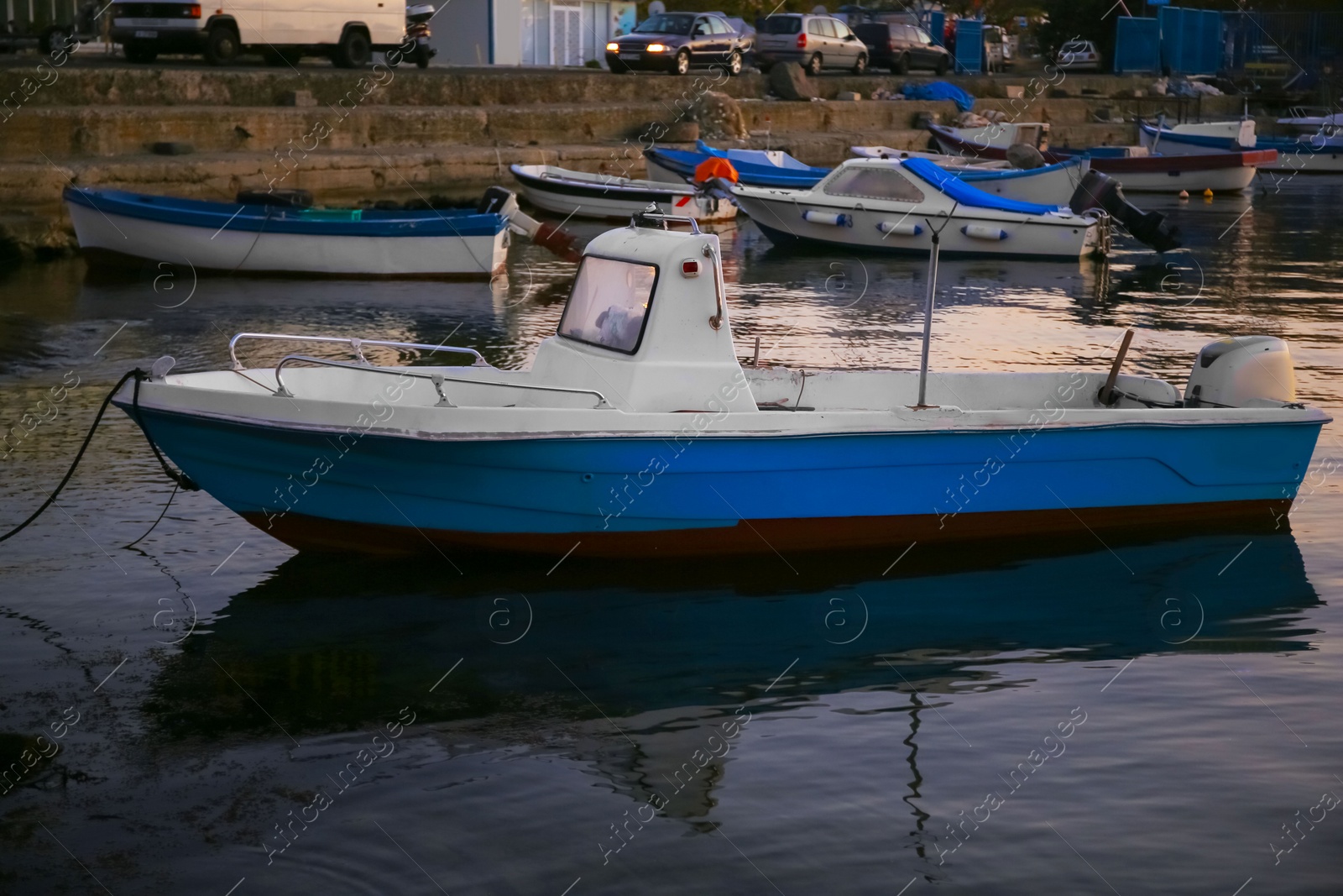 Photo of Beautiful view of river with moored boats at sunset