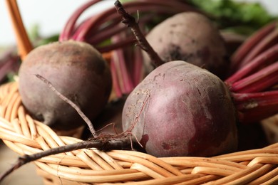 Raw ripe beets in wicker basket, closeup