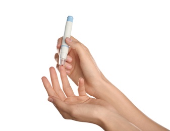 Photo of Woman using lancet pen on white background. Diabetes test