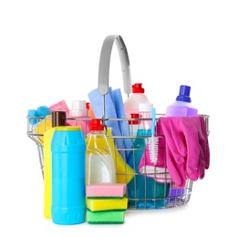 Metal shopping basket with different household chemicals on white background