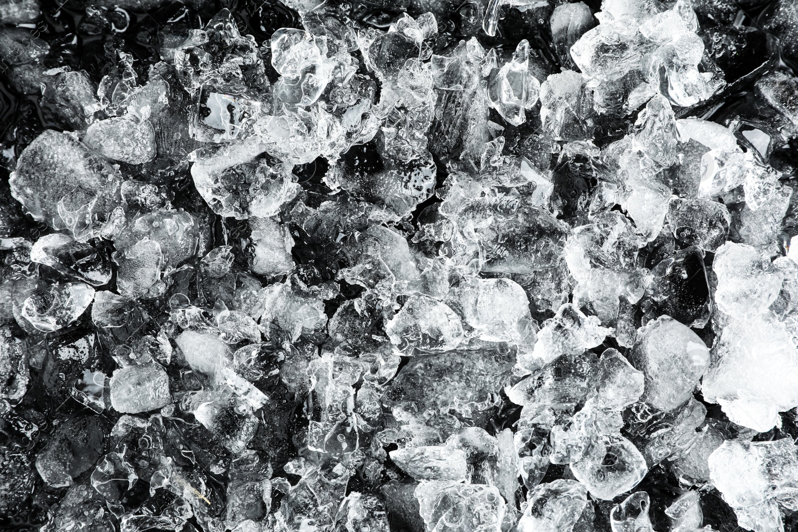 Photo of Clear crushed ice as background, top view