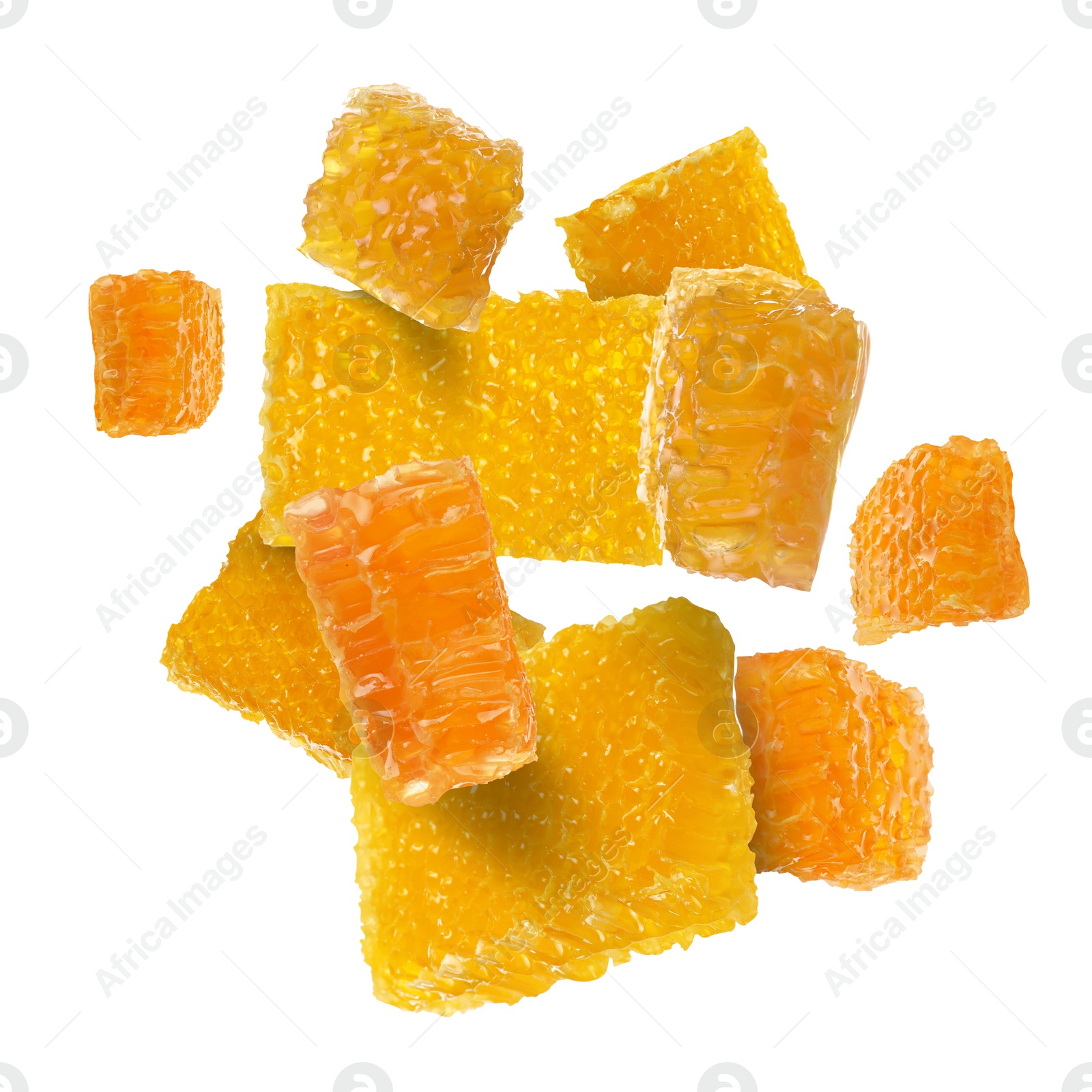 Image of Pieces of honeycomb falling on white background