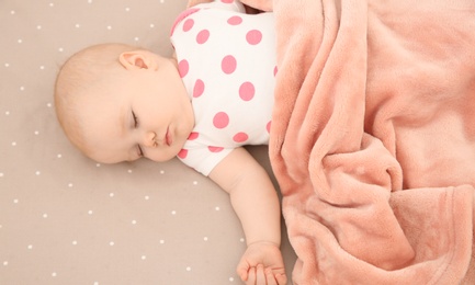 Photo of Cute baby girl sleeping in crib. Bedtime schedule