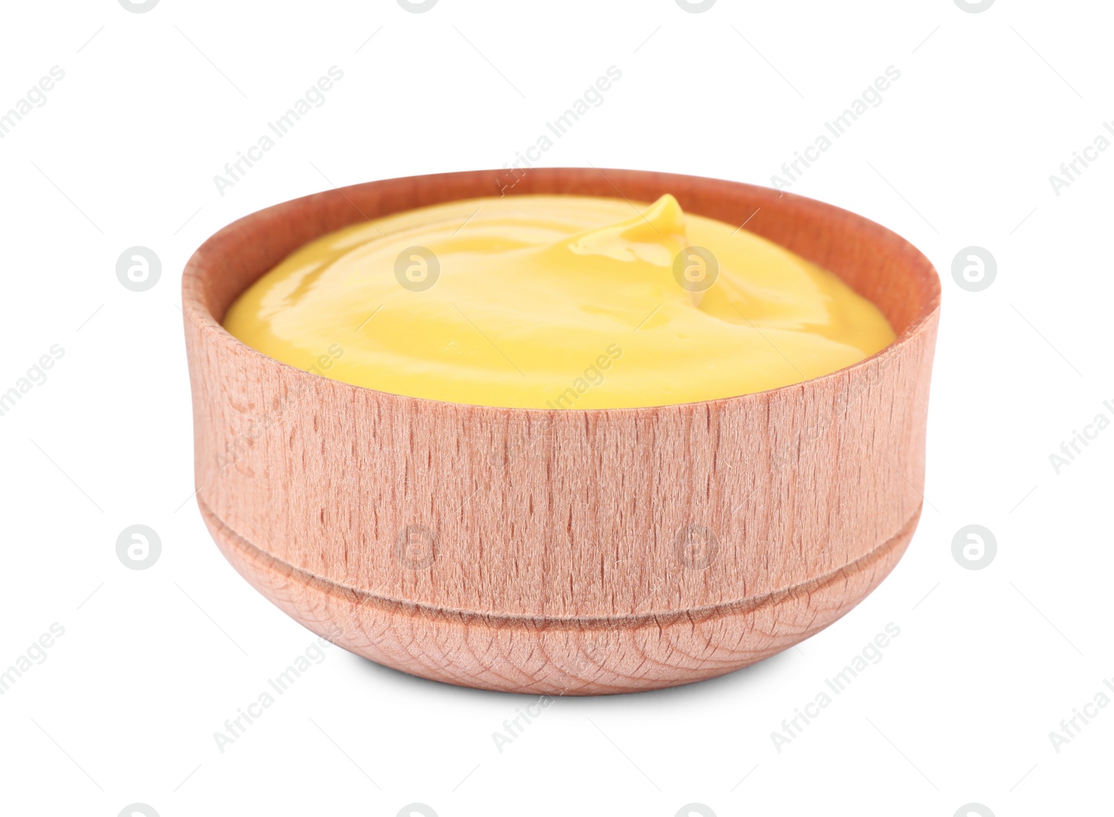 Photo of Spicy mustard in wooden bowl isolated on white