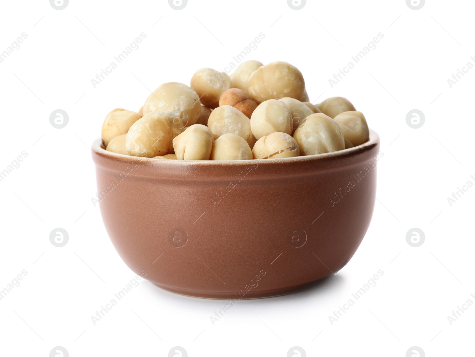 Photo of Bowl with shelled organic Macadamia nuts on white background