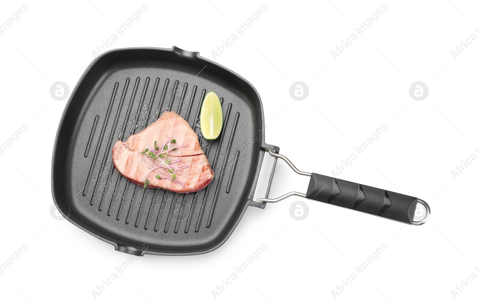Photo of Delicious tuna steak with lime in grill pan on white background, top view
