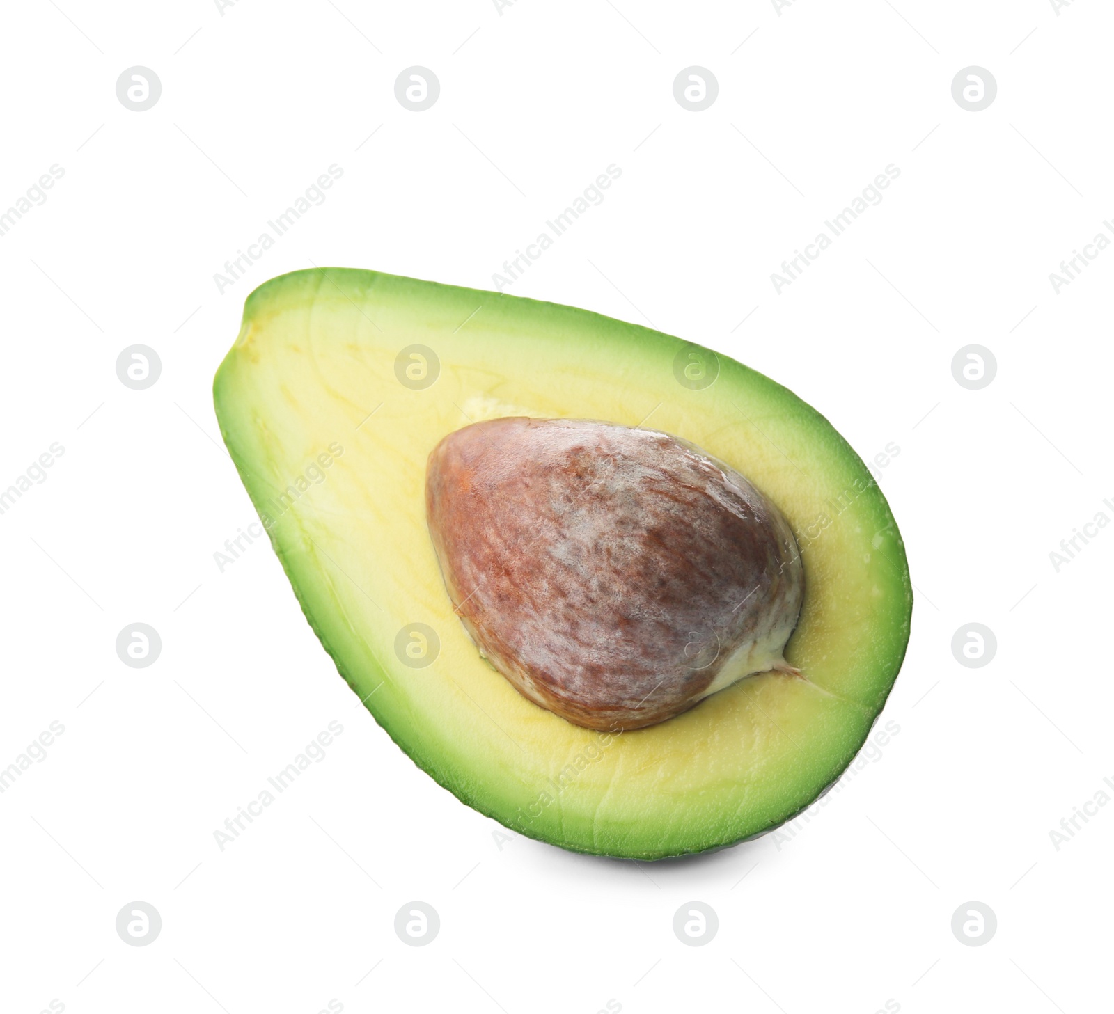 Photo of Half of ripe avocado with pit on white background