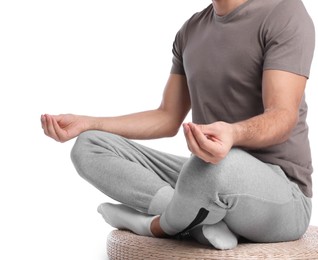 Photo of Man meditating on white background, closeup. Harmony and zen