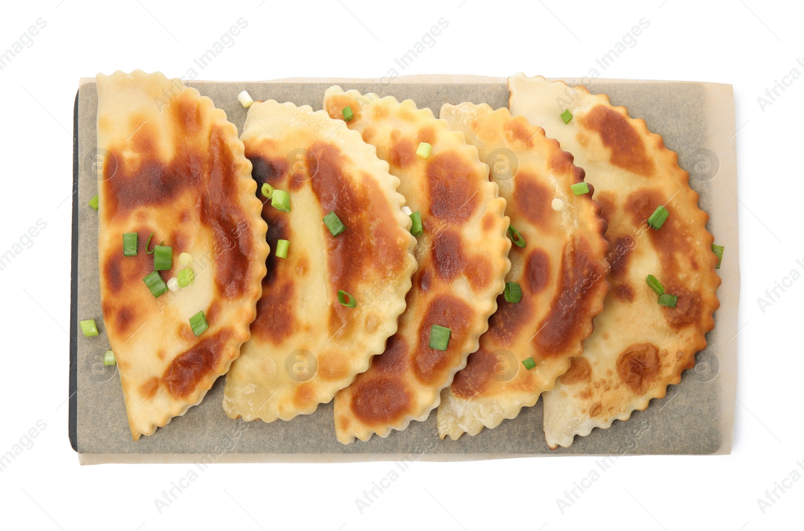 Photo of Board with delicious fried chebureki isolated on white, top view