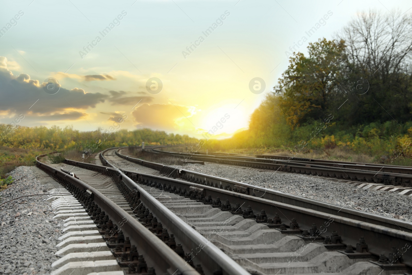 Photo of Railway lines with track ballast in countryside. Train journey