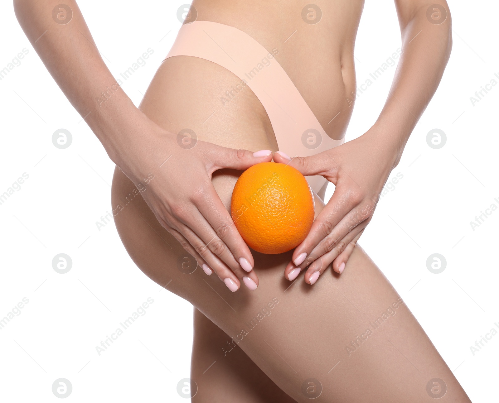 Photo of Closeup view of slim woman in underwear with orange on white background. Cellulite problem concept