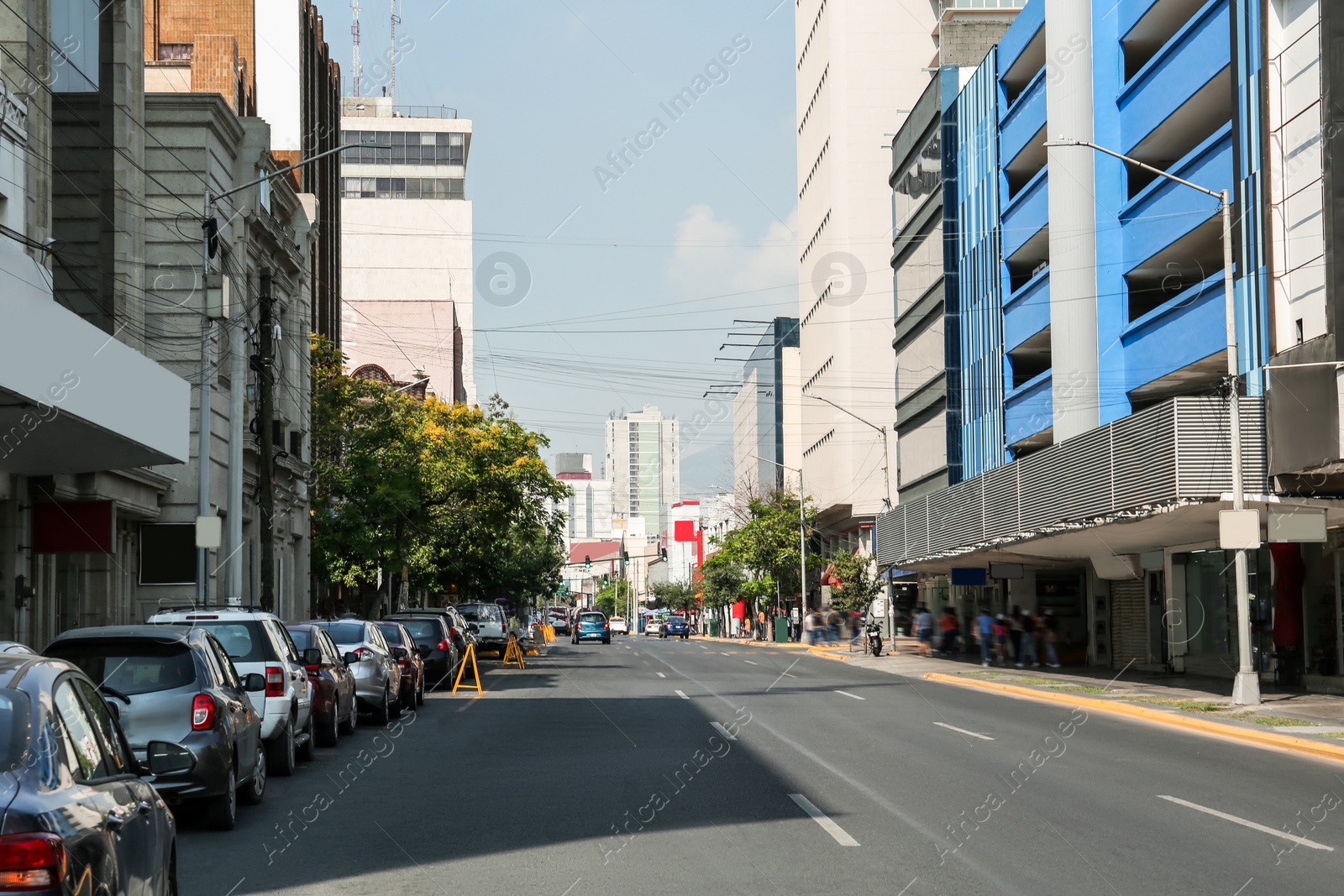 Photo of Beautiful view of city street with modern buildings