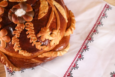 Korovai on rushnyk, closeup. Ukrainian bread and salt welcoming tradition