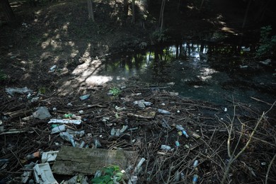 Pile of different garbage on ground outdoors