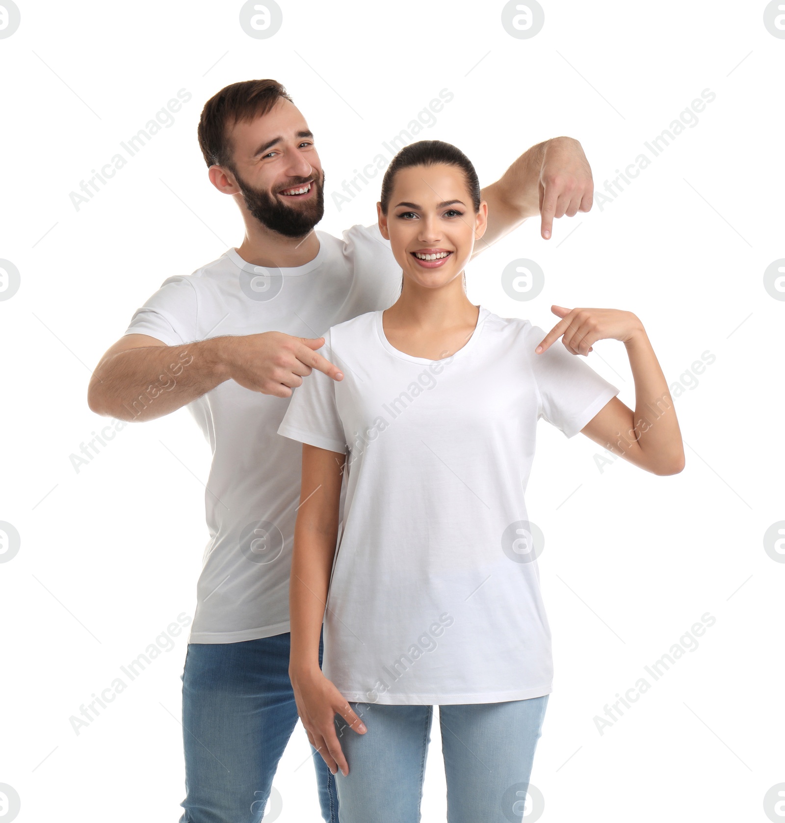 Photo of Young couple in t-shirts on white background. Mockup for design