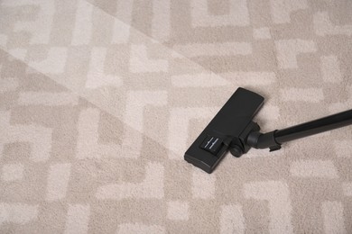 Image of Vacuuming dirty carpet. Clean area after using device, closeup