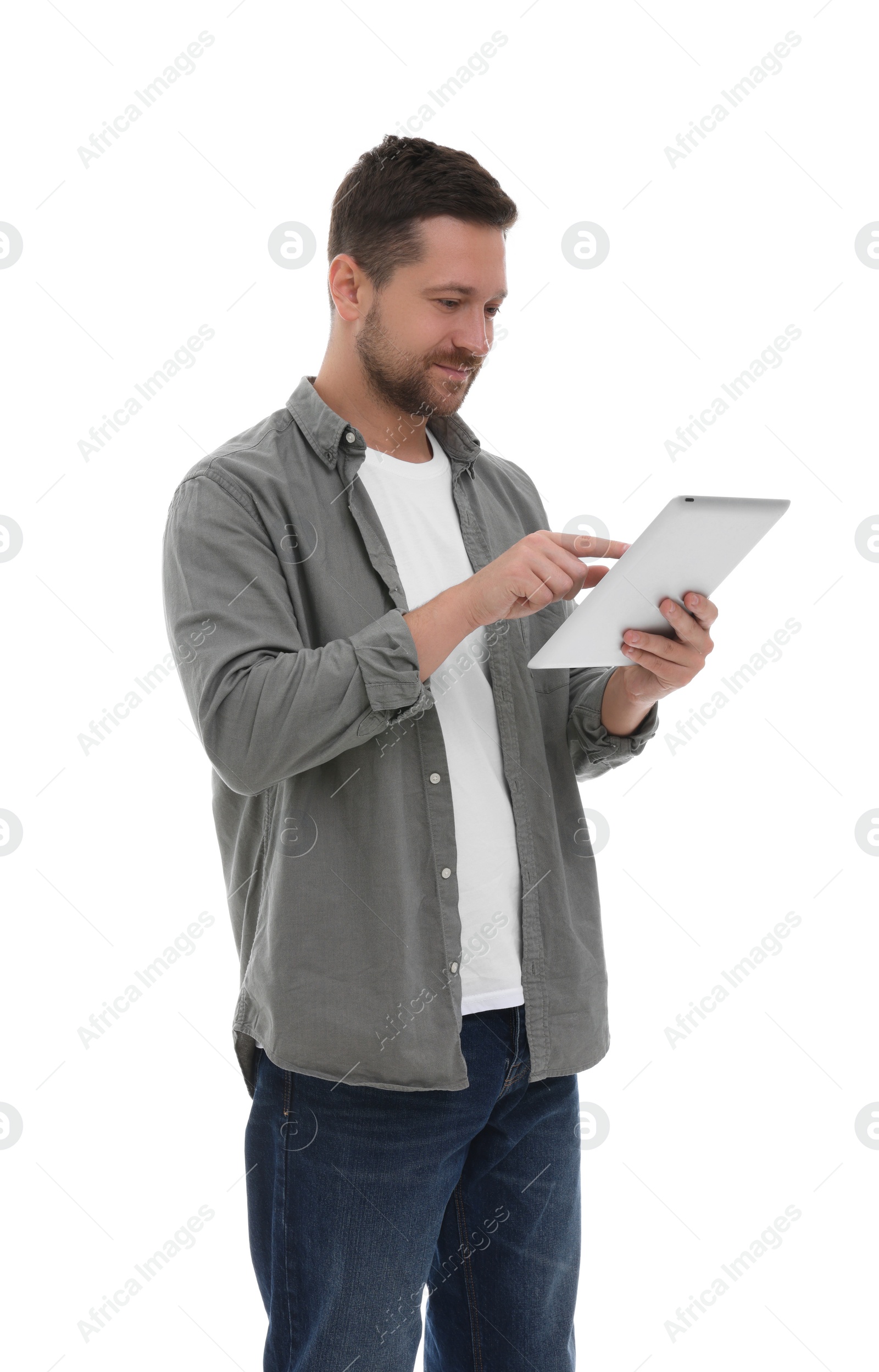 Photo of Handsome man using tablet on white background