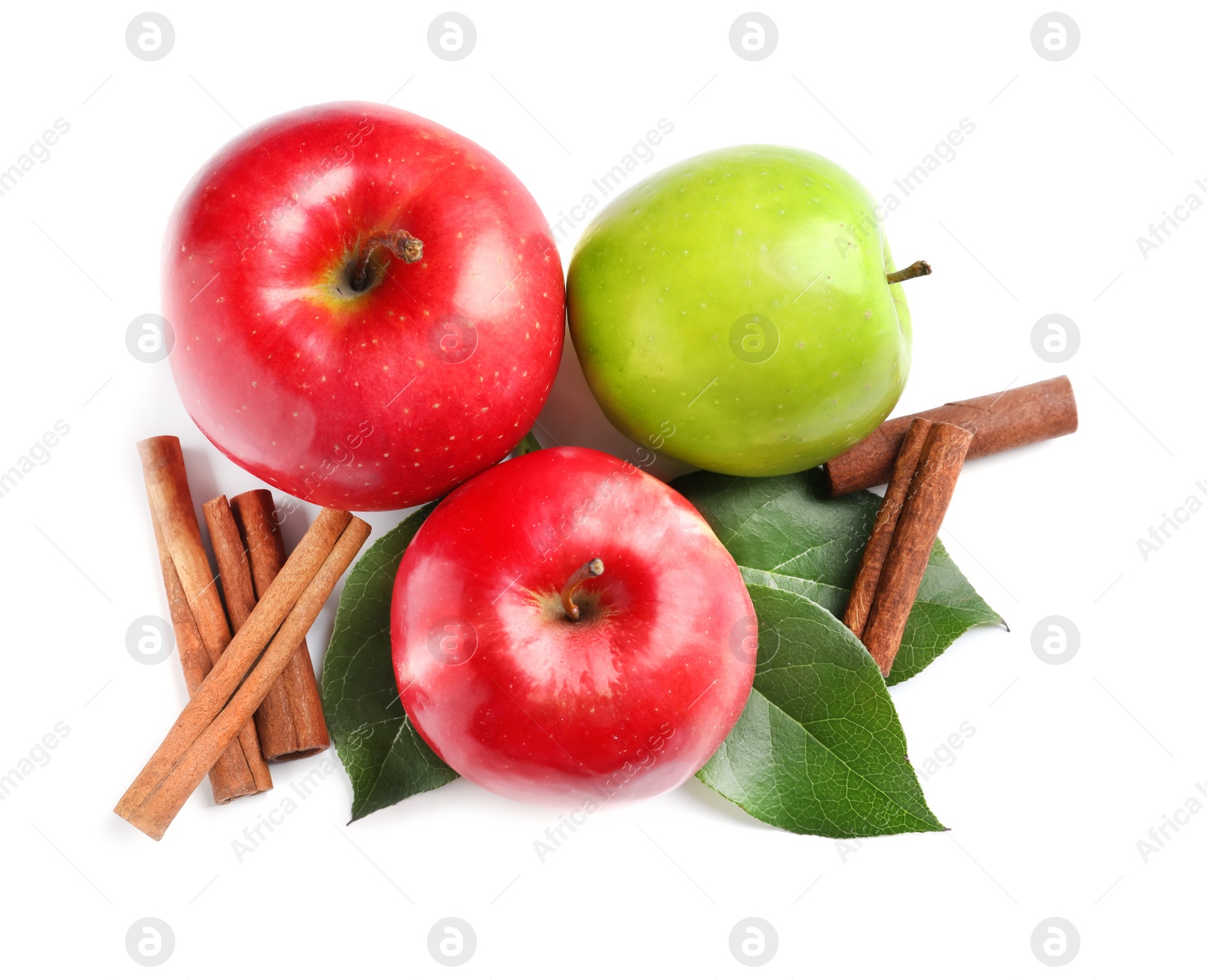 Photo of Fresh apples and cinnamon sticks on white background