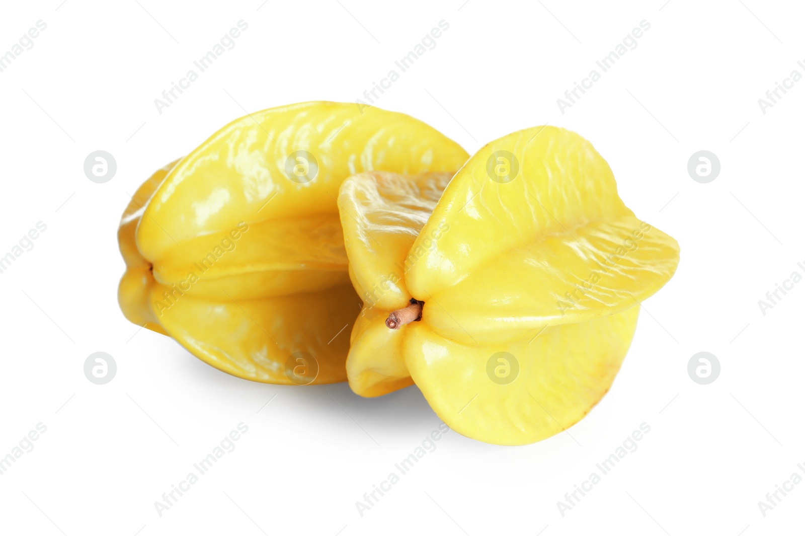 Photo of Delicious ripe carambolas on white background. Exotic fruit