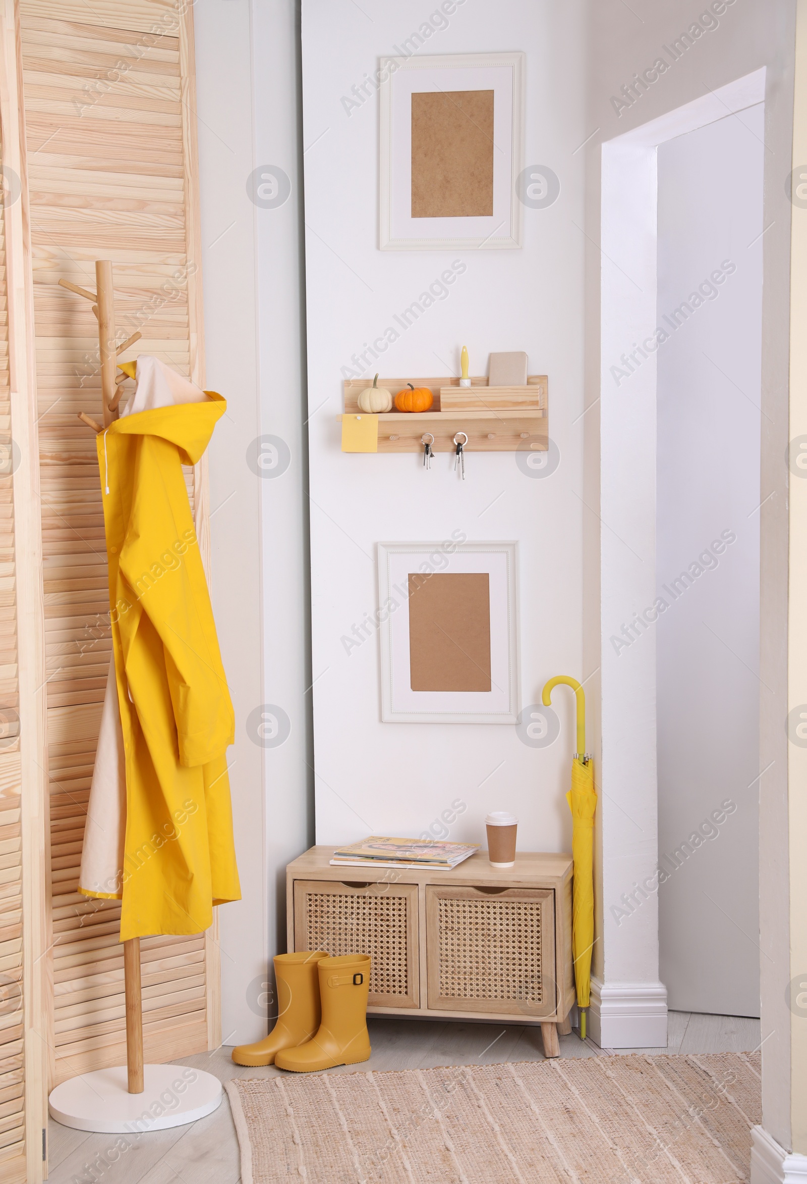 Photo of Modern hallway interior with stylish furniture and key holder