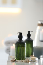 Photo of Soap dispensers and decor elements on table