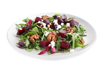 Photo of Delicious beet salad with arugula and walnuts isolated on white