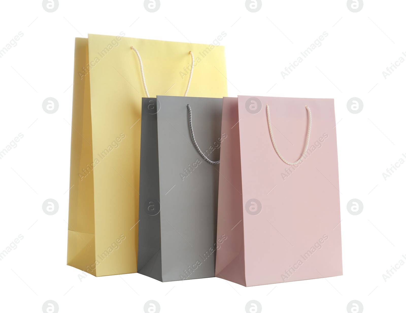 Photo of Different paper shopping bags isolated on white