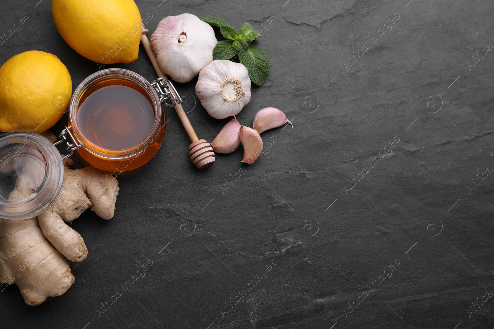 Photo of Cold remedies on black table, flat lay and space for text. Cough treatment