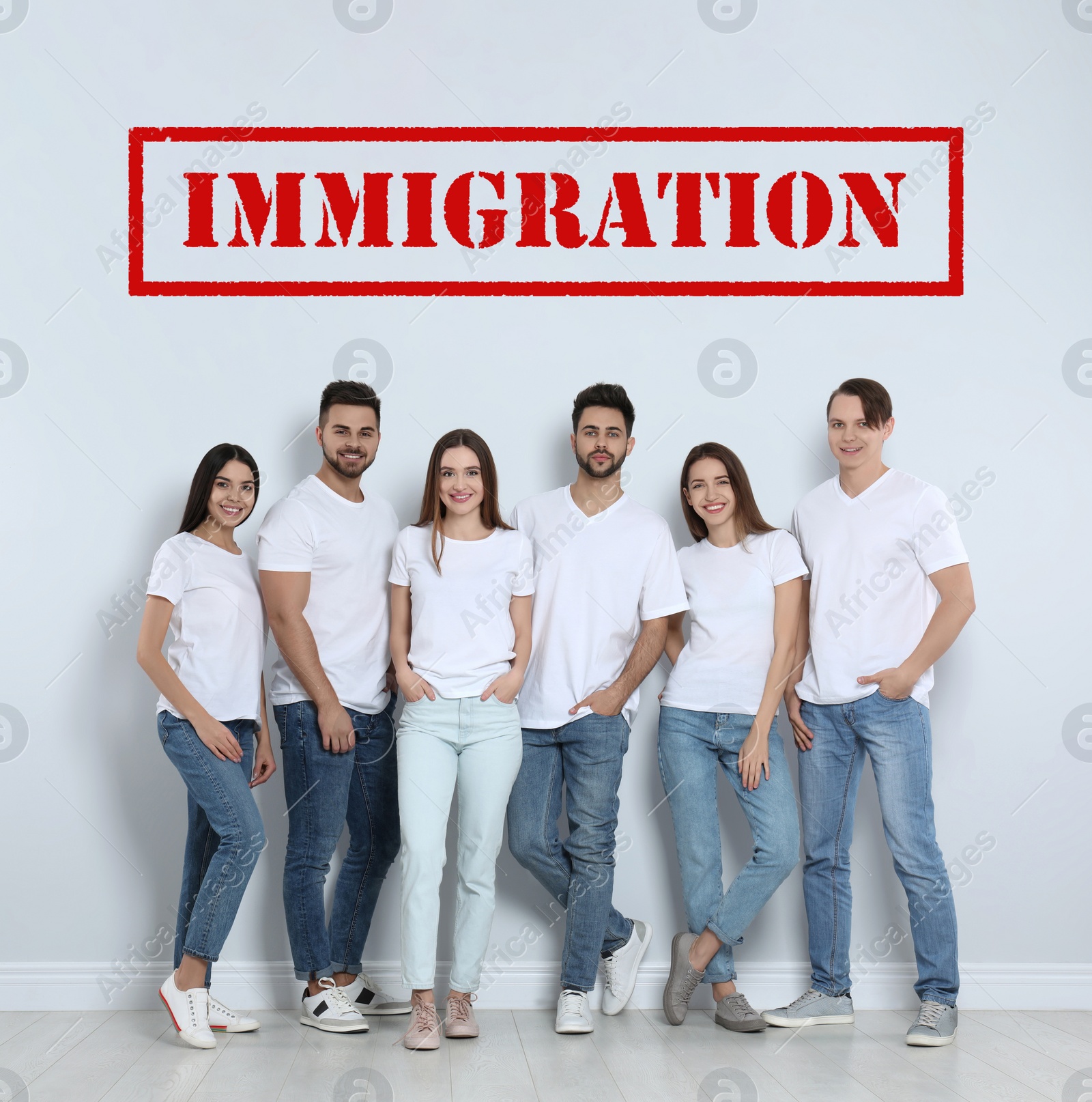 Image of Immigration concept. Group of young people standing near light wall