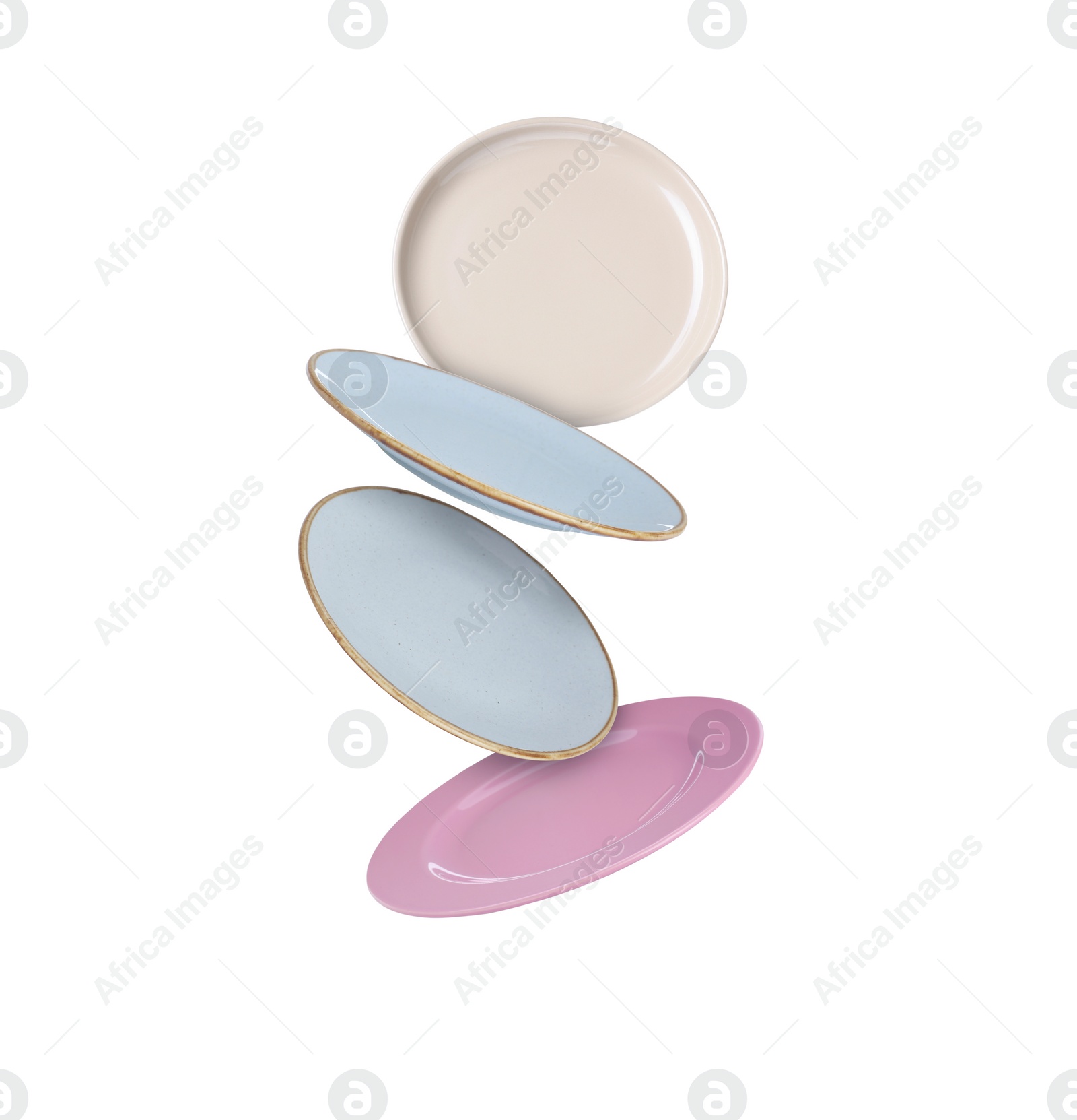 Image of Many different plates falling on white background