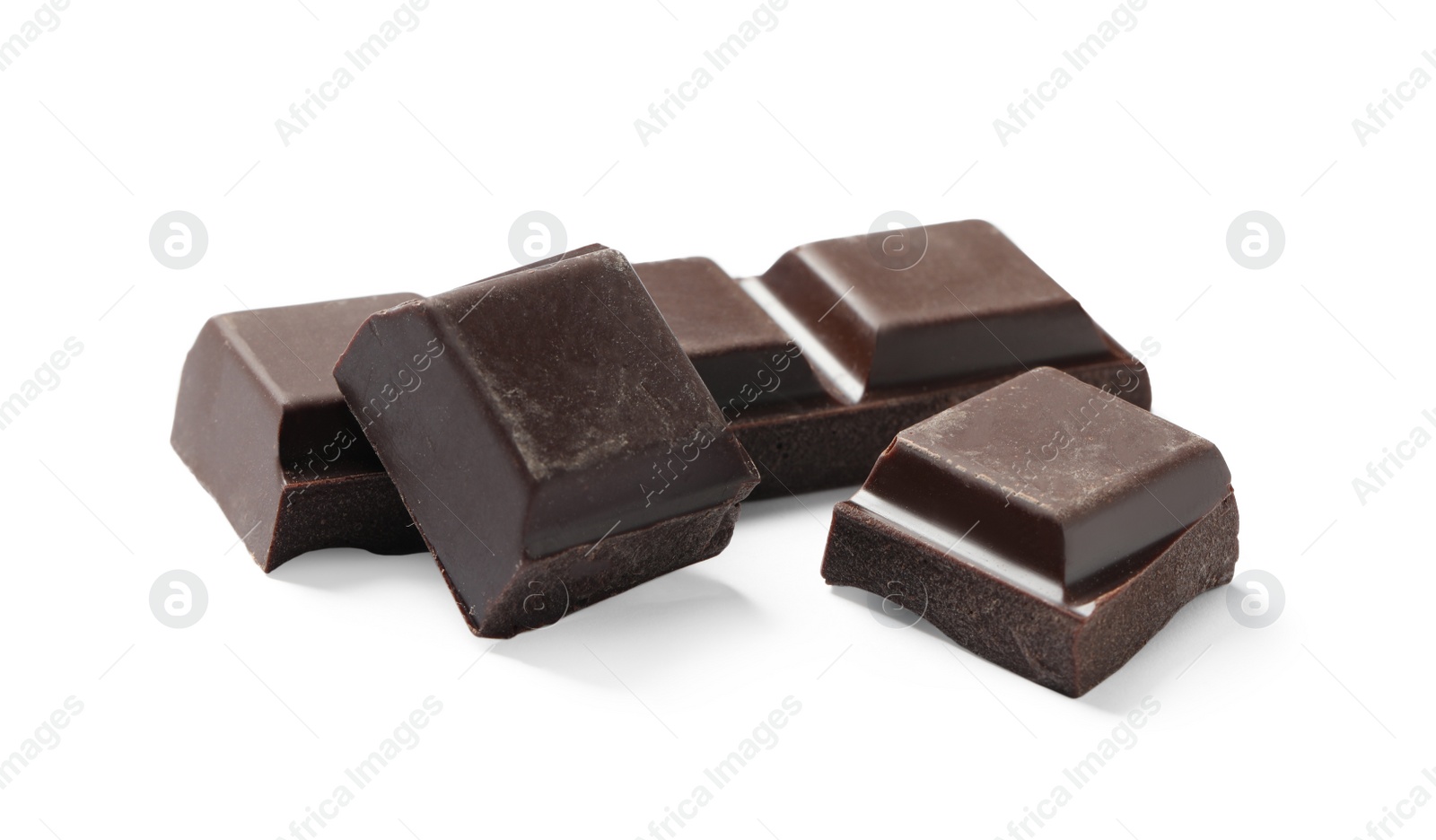 Photo of Pieces of delicious dark chocolate isolated on white