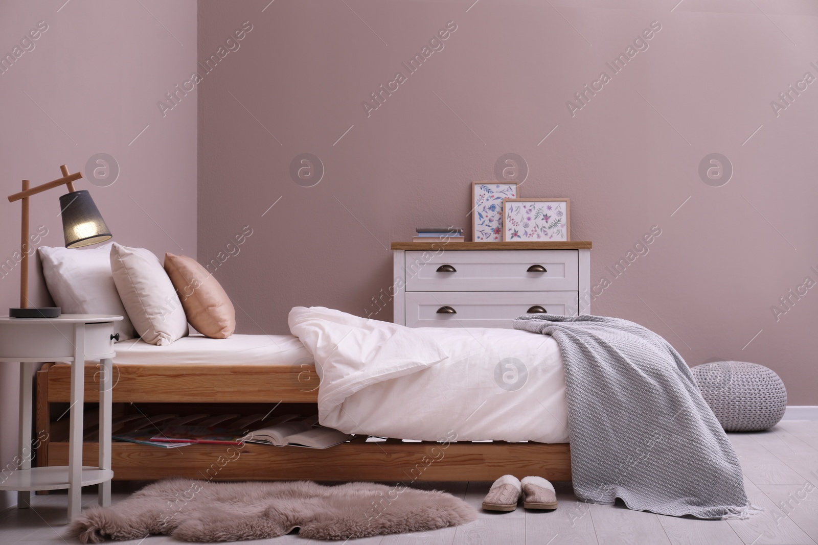 Photo of Cozy bed with soft linens in light room