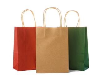 Mockup of paper shopping bags on white background