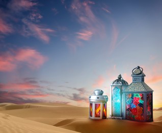 Image of Beautiful Arabic lanterns on sand at sunrise , space for text