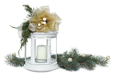 Photo of Decorative Christmas lantern with candle and fir branches on white background