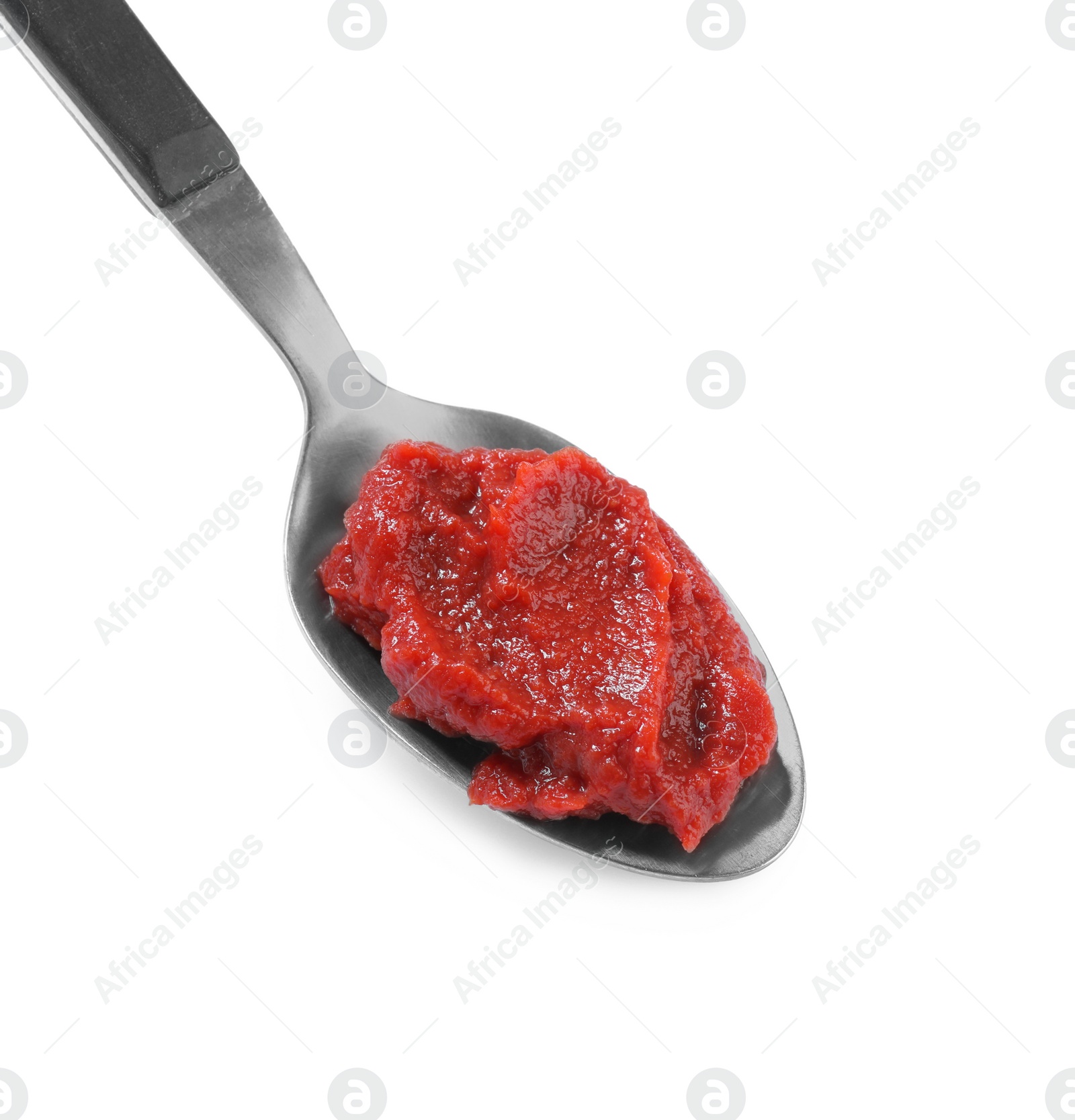 Photo of Spoon of tasty tomato paste isolated on white