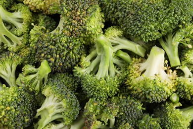 Photo of Fresh raw broccoli as background, top view