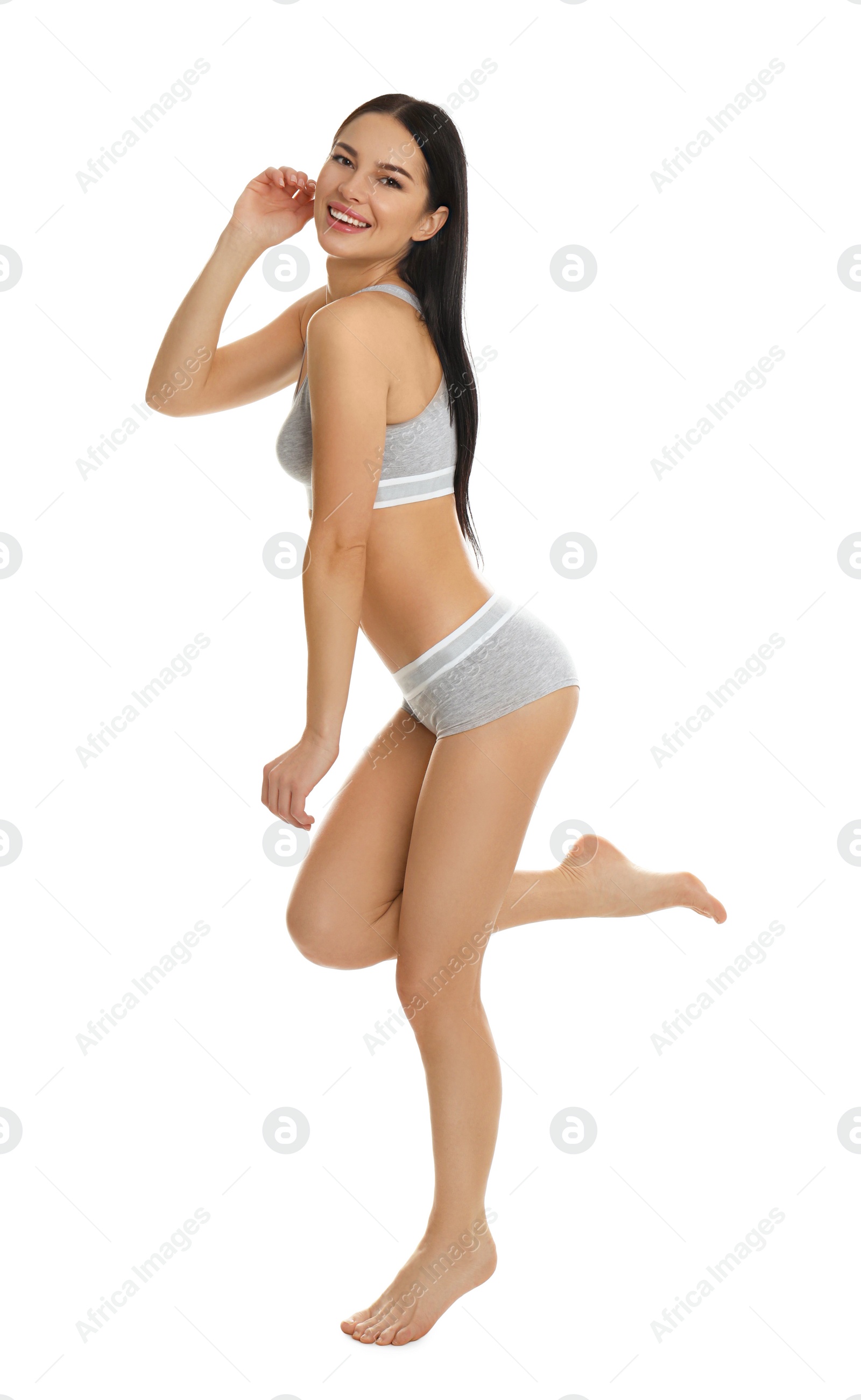 Photo of Beautiful young woman in grey sportive underwear isolated on white