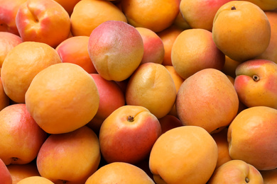 Delicious fresh ripe apricots as background, closeup