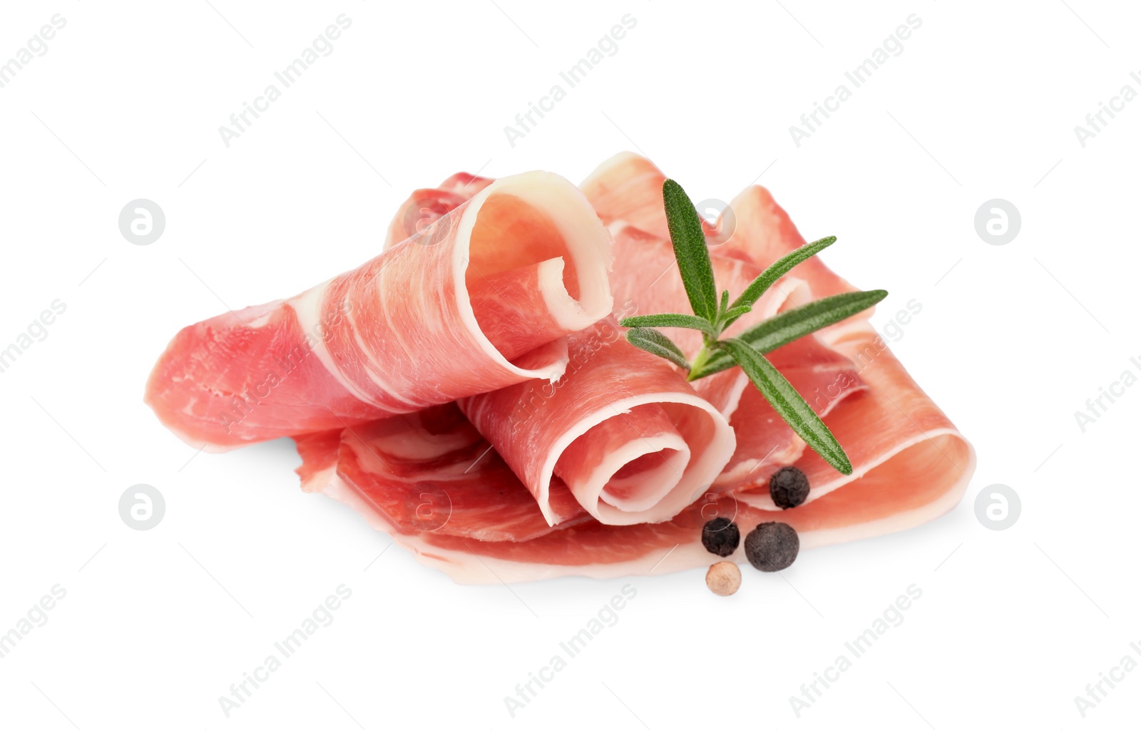 Photo of Slices of delicious jamon, spices and rosemary isolated on white